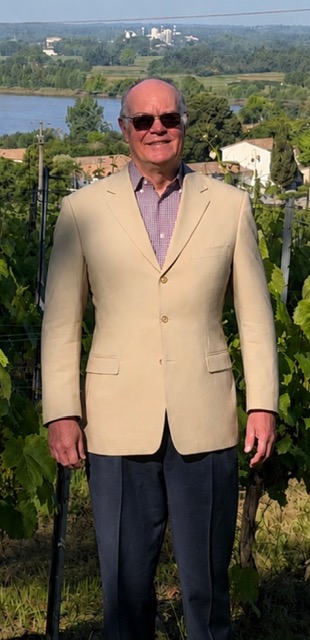 Bordeaux Brian standing in a Bordeaux vineyard overlooking the river